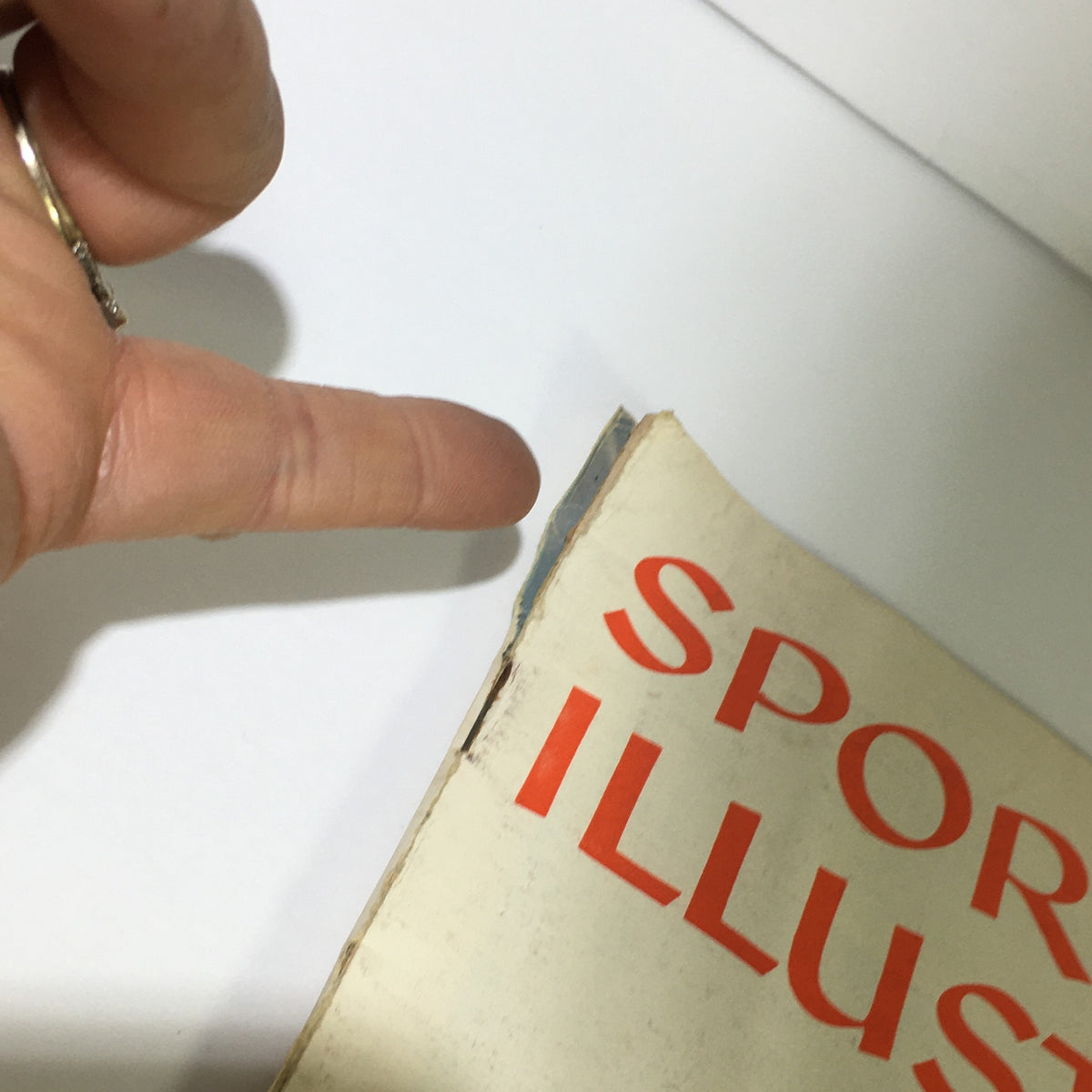 Detailed view of the spine of the Vintage Sports Illustrated Magazine July 28 1958, showing minor wear and tear typical for its age. Ideal for collectors of sports memorabilia.