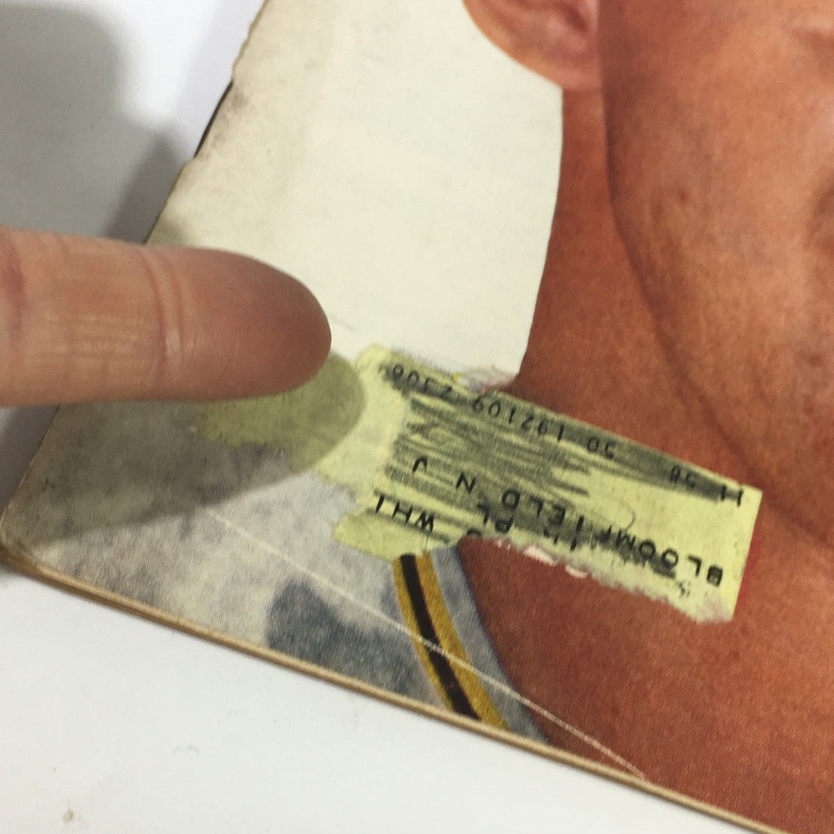 Close-up detail of the Vintage Sports Illustrated Magazine from July 28, 1958 featuring Frank Thomas of the Pittsburgh Pirates, showing minor wear on the cover with a finger pointing to a corner.