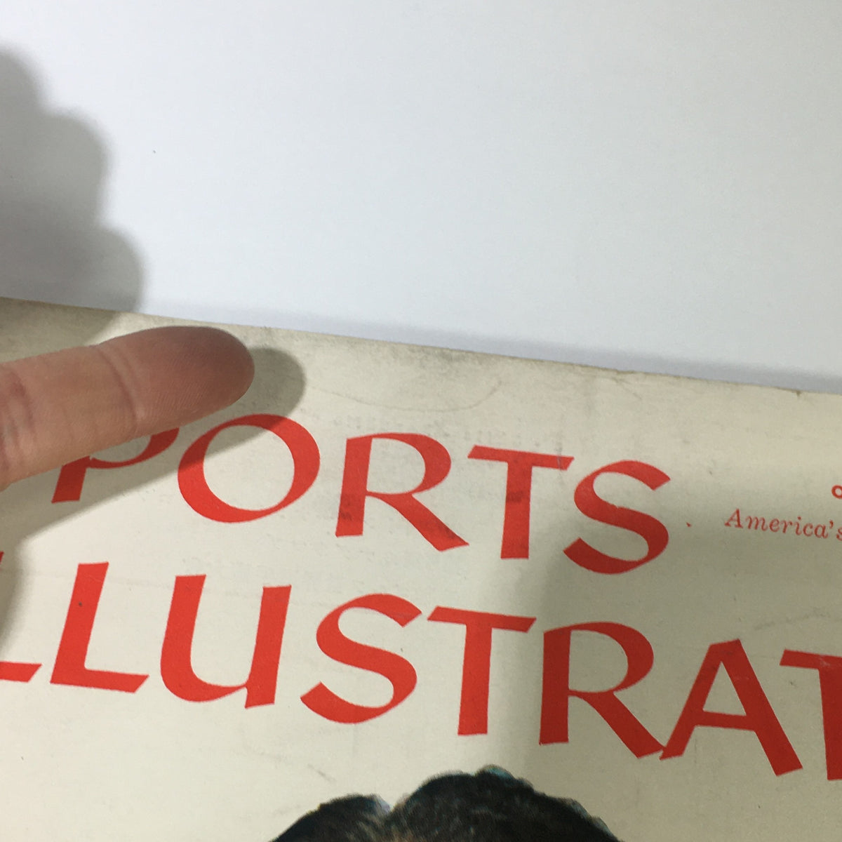 Close-up image of the Sports Illustrated magazine title and date from October 14, 1957, showcasing its historical context and content focus on bridge playing by Charles Goren.