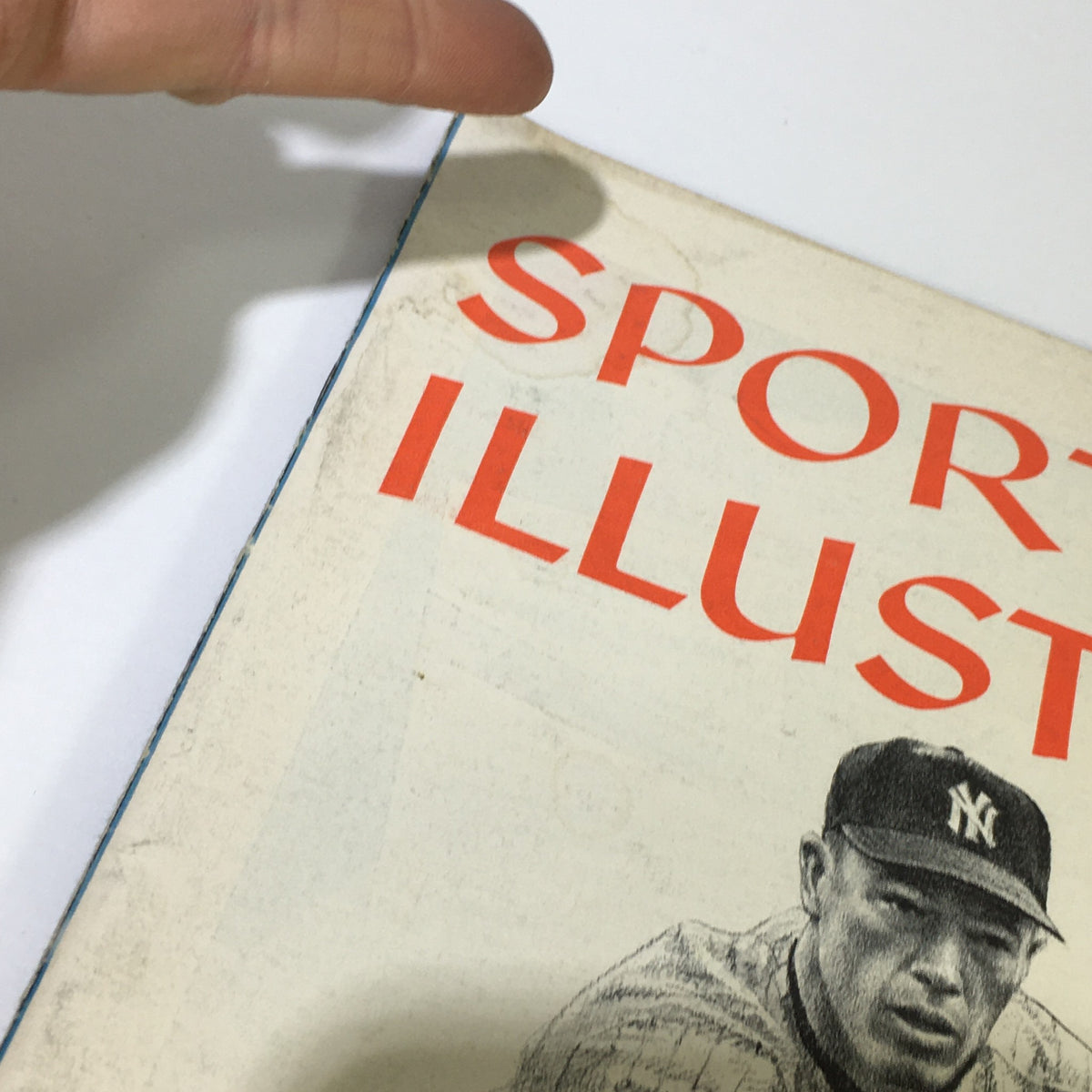 Close-up view of the title 'SPORTS ILLUSTRATED' from the 'VTG Sports Illustrated Magazine May 5 1958', displays slight wear and vintage aesthetics.