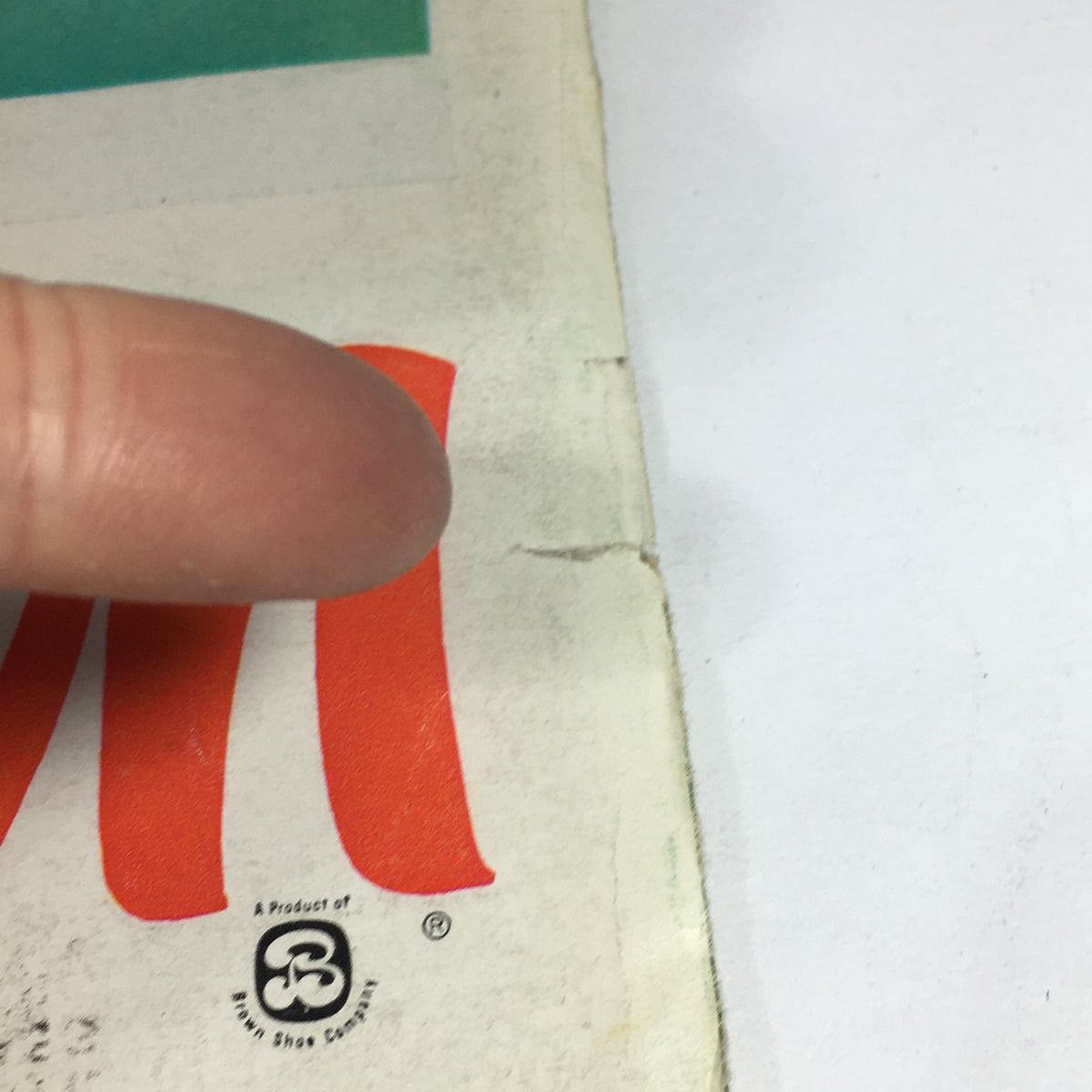 Close-up view of the corner of the VTG Sports Illustrated Magazine April 15 1957 - Special Baseball Issue, highlighting minor wear and a crease for potential collectors.