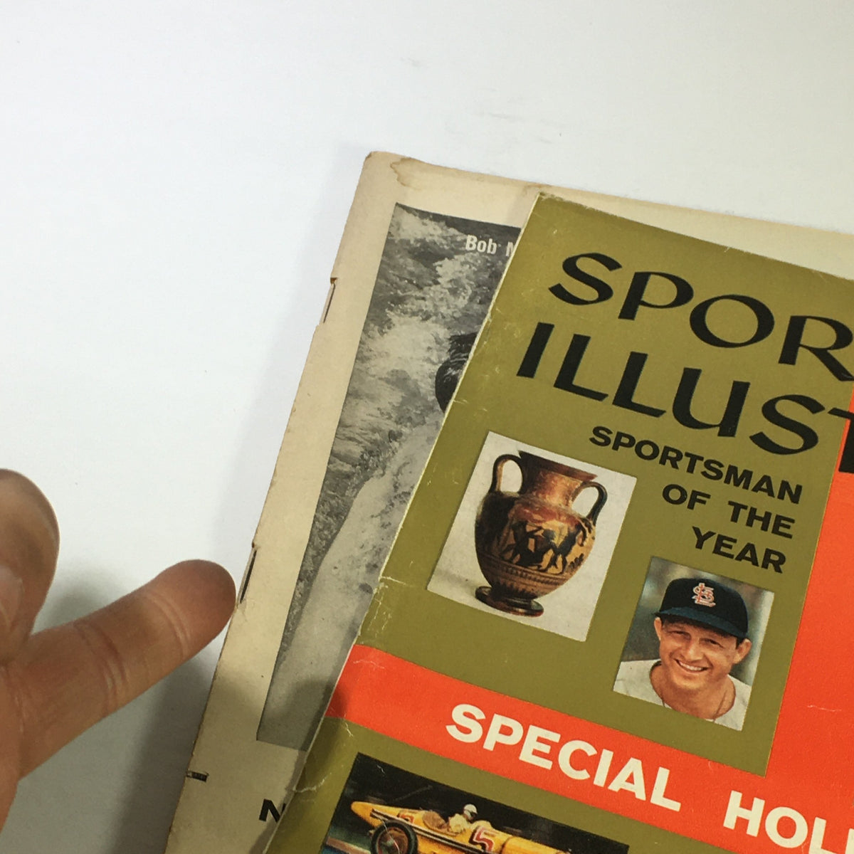 Detail view of the cover of the VTG Sports Illustrated Magazine December 23, 1957, highlighting the 'Sportsman of the Year' section and various colorful features.