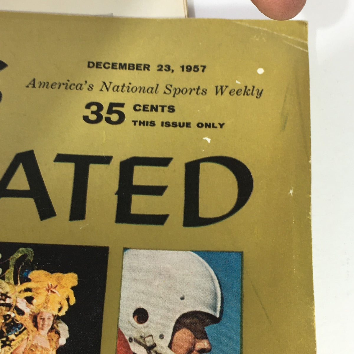 Close-up view of the cover of the Sports Illustrated Magazine December 23, 1957, displaying the issue's date and cost, emphasizing its collectible nature.