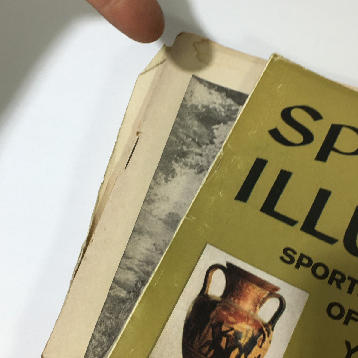 Side view of the Sports Illustrated Magazine December 23, 1957, highlighting the magazine's spine and vintage design elements, adding to its historical value.