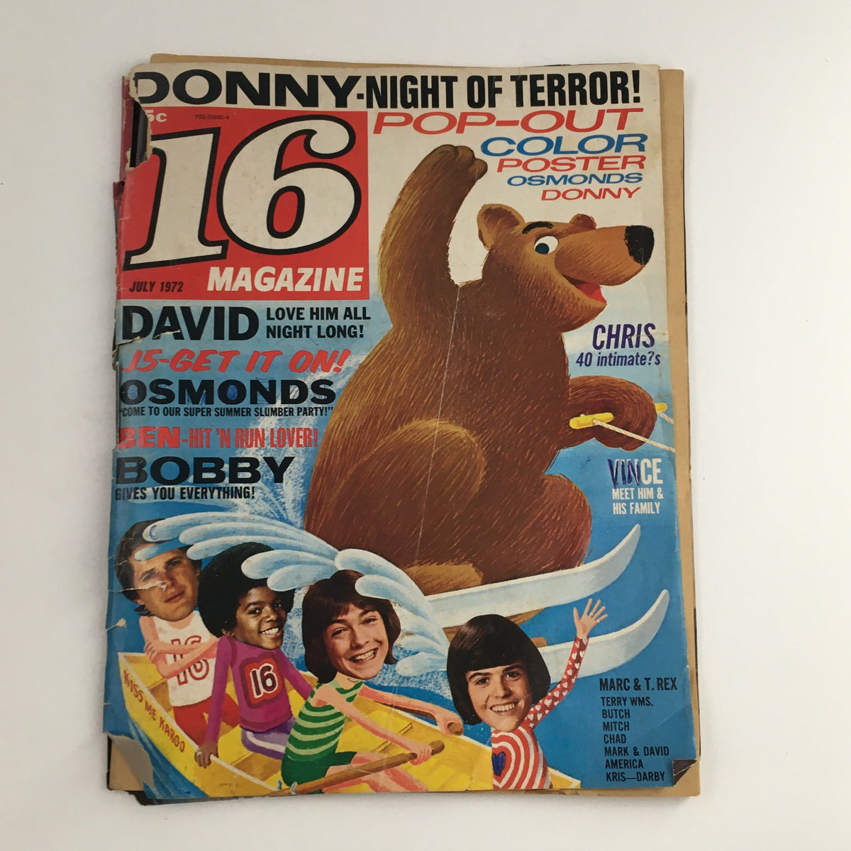 Cover of 16 Magazine July 1972 featuring David Cassidy, The Osmonds, and Bobby Sherman. The colorful magazine highlights pop culture icons of the 70s with a bear illustration, promoting a pop-out poster inside. Ideal for fans of vintage magazines and collectors.