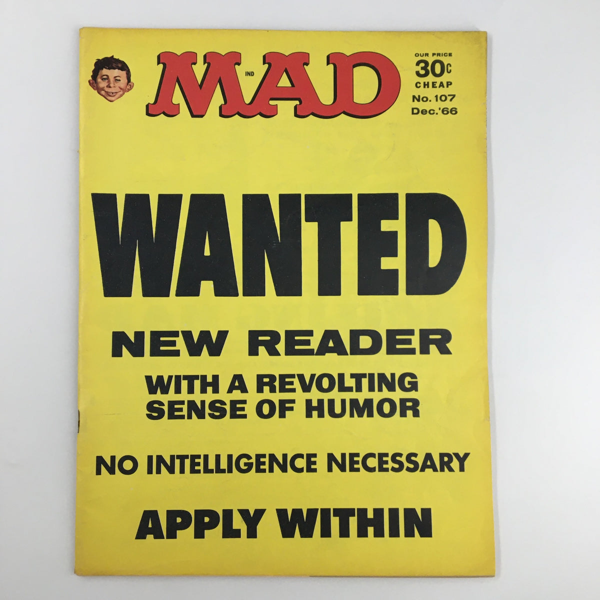 Cover of Mad Magazine December 1966 Issue No. 107 featuring a bright yellow background and the title 'WANTED NEW READER' with a playful humor theme.