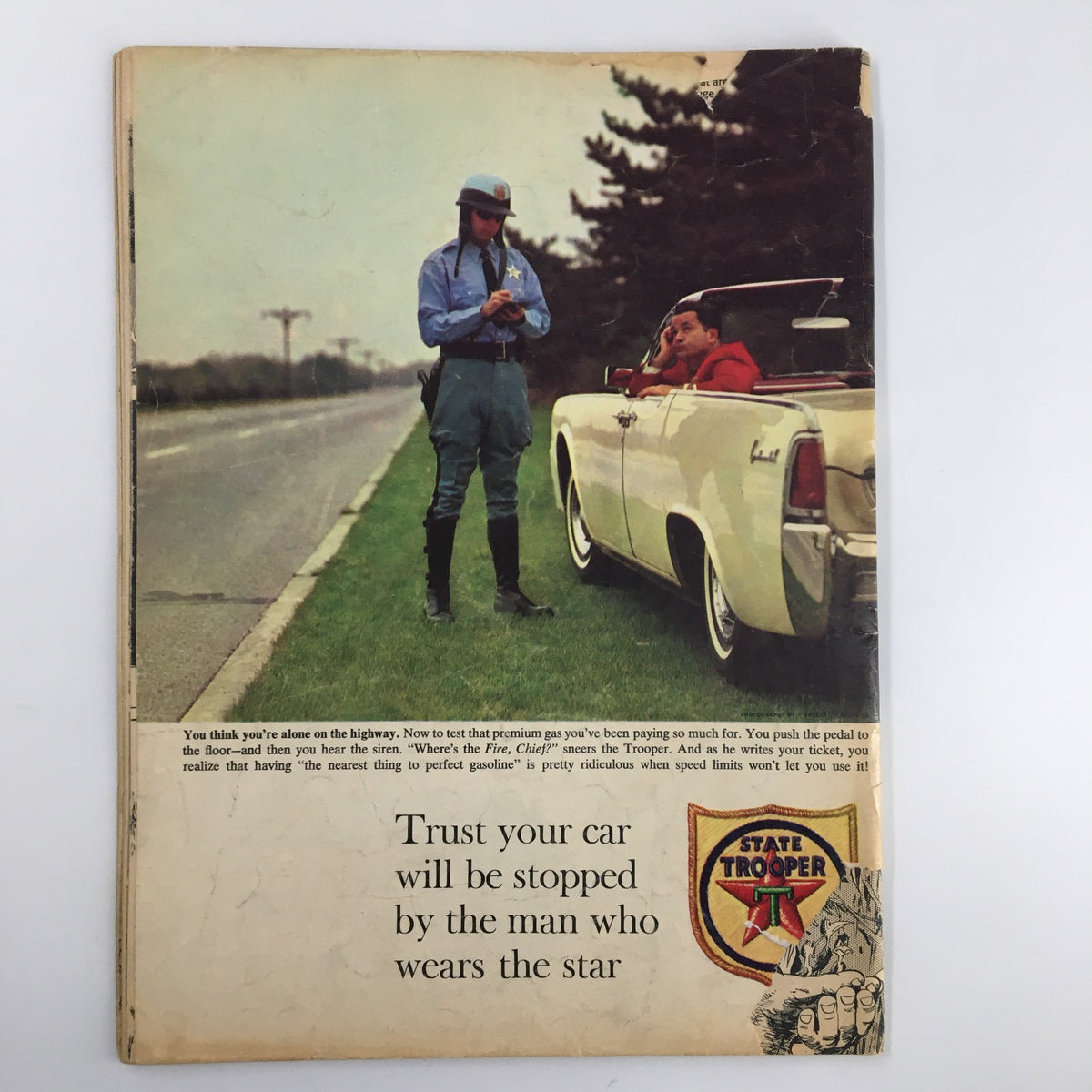 Back cover of Mad Magazine October 1963 No. 82, depicting a humorous scene involving a state trooper and a motorist with a vintage car.