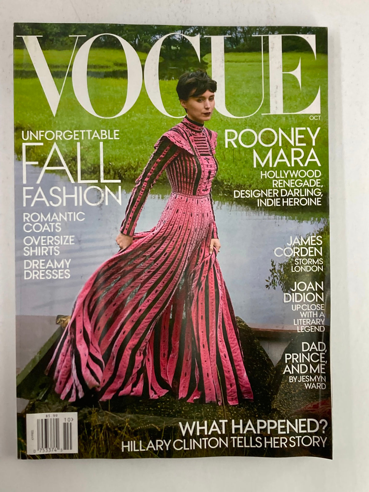 Vogue Magazine October 2017 cover featuring Rooney Mara as a Hollywood renegade in a stunning pink dress against a natural backdrop showcasing fall fashion.