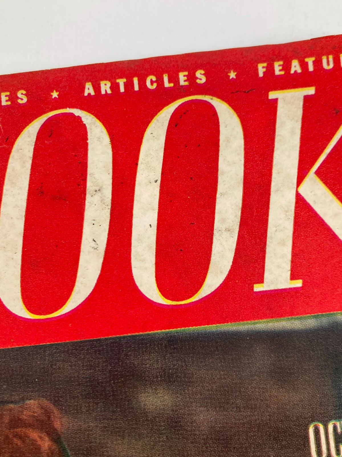 Detail shot of the title 'REDBOOK' from the October 1947 issue, emphasizing its vintage appeal.