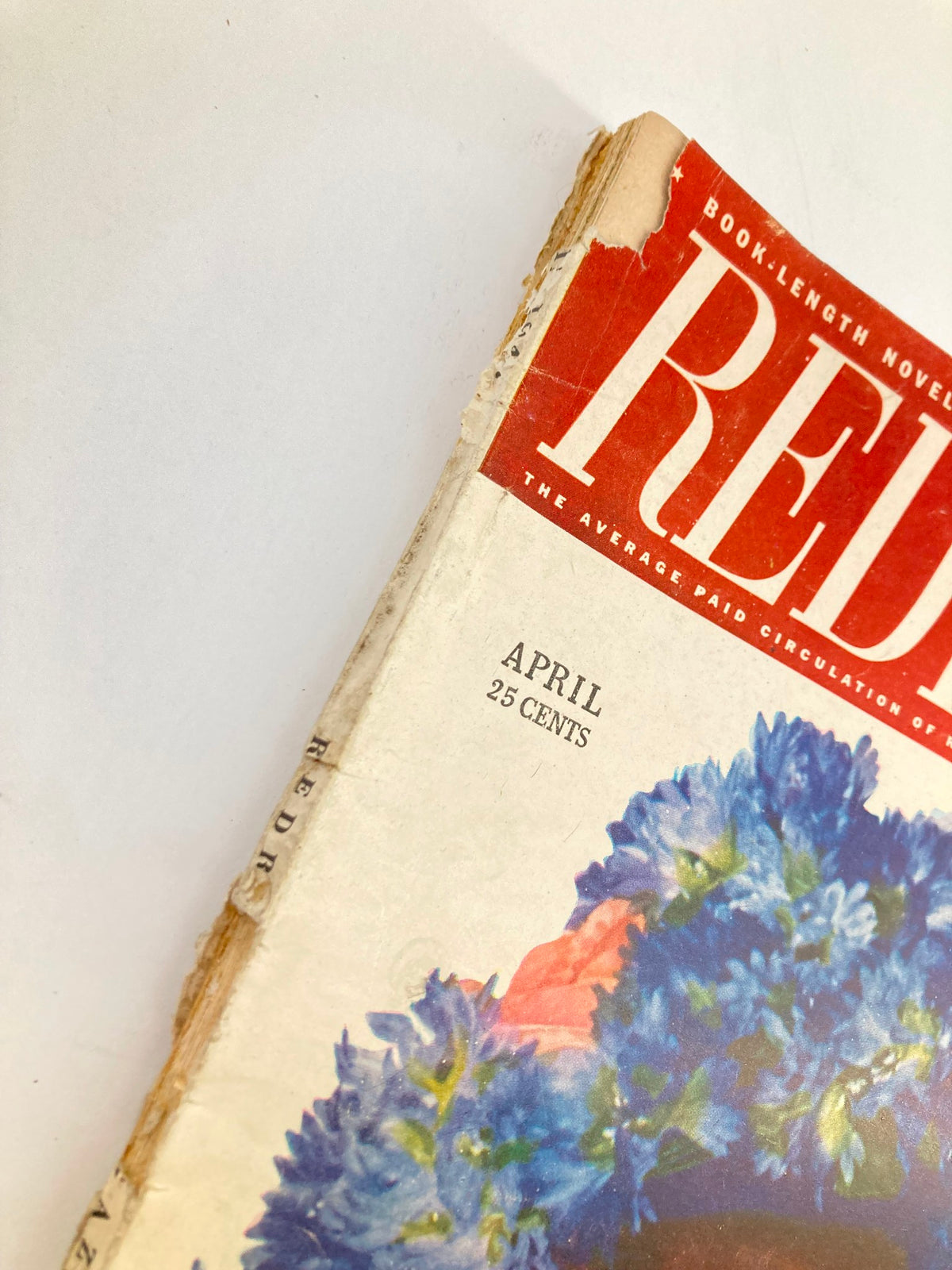 Close-up of the corner of the VTG Redbook Magazine April 1947 cover showing the publication month and price.