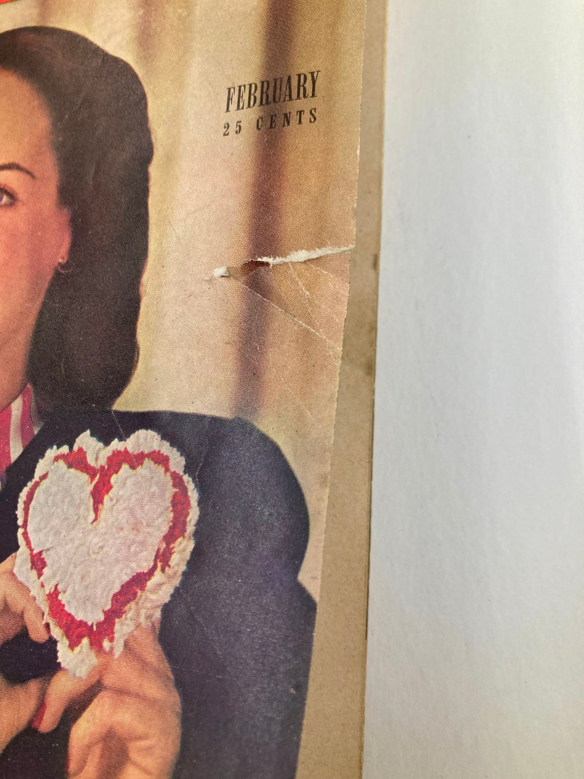 Close-up of the top section of the VTG Redbook Magazine February 1948 cover. Includes details of the price and month: 'February 25 cents'.