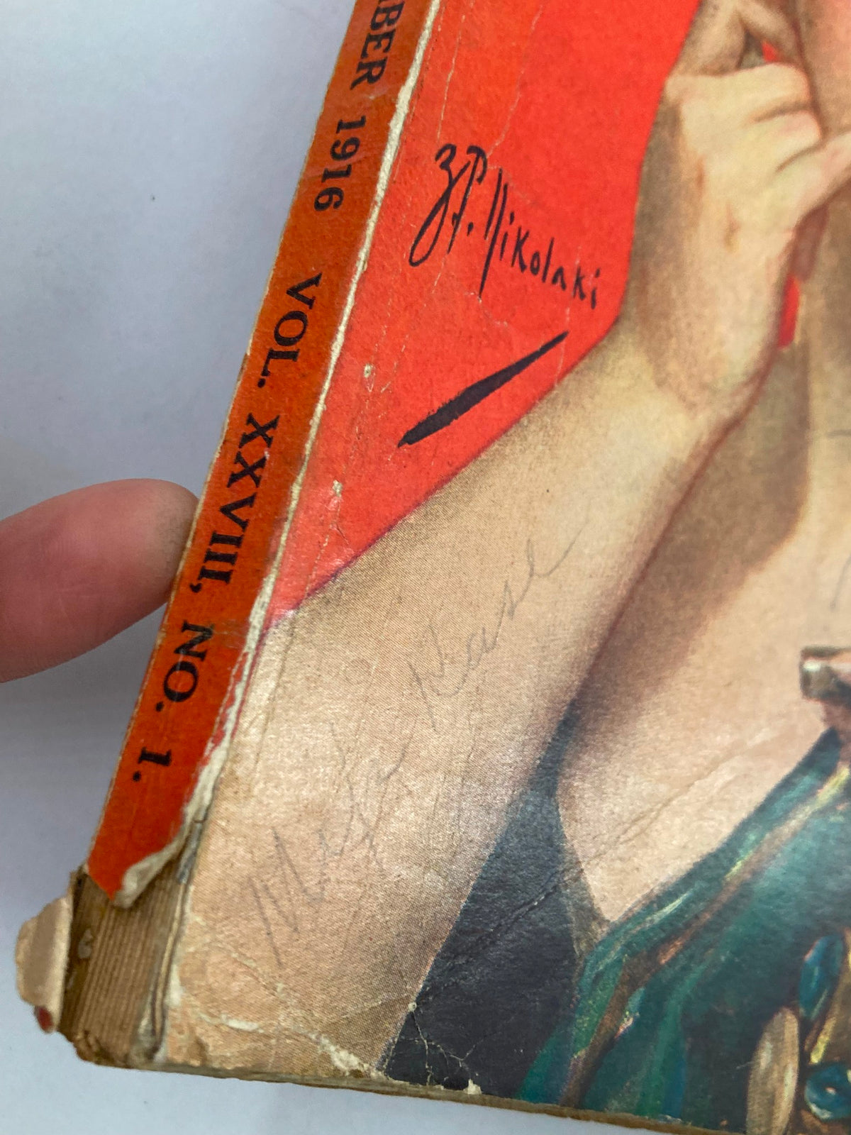 Close-up of the spine of VTG Redbook Magazine November 1916 showing volume number and signature, with wear indicating its vintage history.