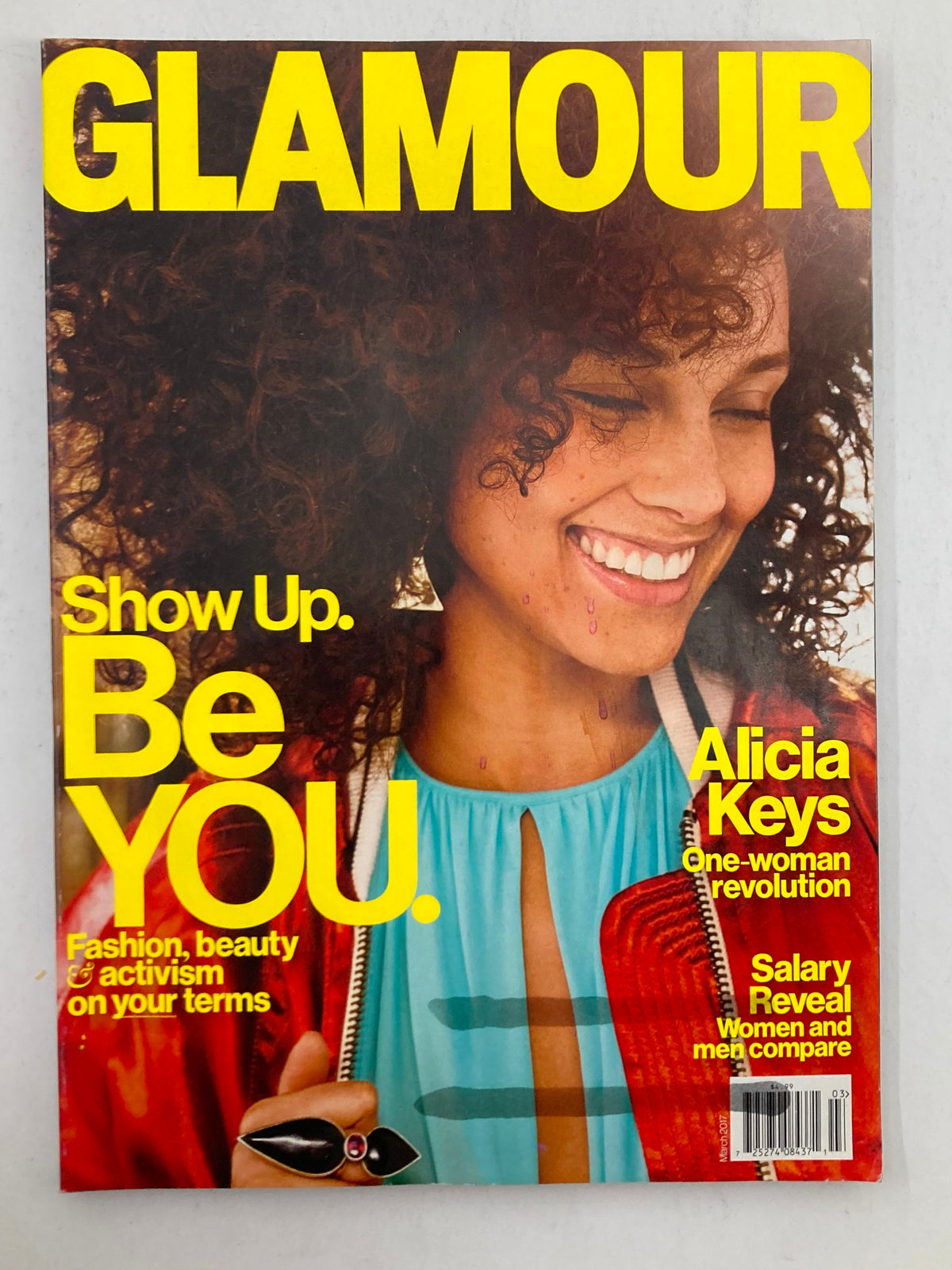 Cover of Glamour Magazine March 2017 featuring Alicia Keys, highlighting the theme of empowerment with her smiling portrait and the tagline 'Show Up. Be YOU.'