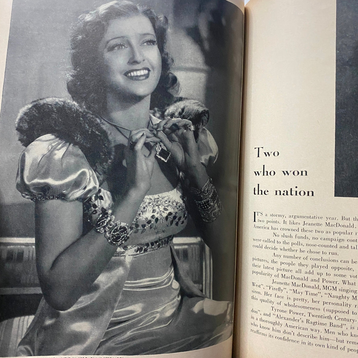 Photograph of a glamorous actress in GLAMOUR OF HOLLYWOOD Magazine April 1939, adorned with jewelry, capturing the essence of vintage Hollywood glamour.