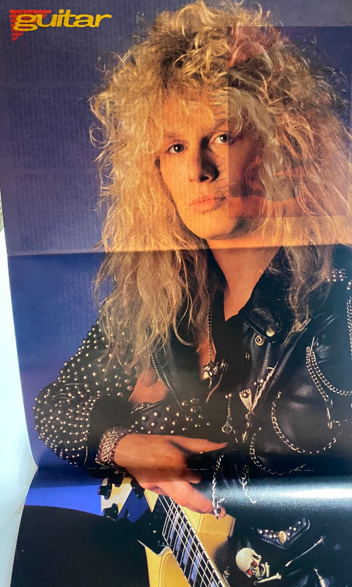Poster feature from Guitar for the Practicing Musician Magazine December 1989 showcasing a prominent rock guitarist with long curly hair.