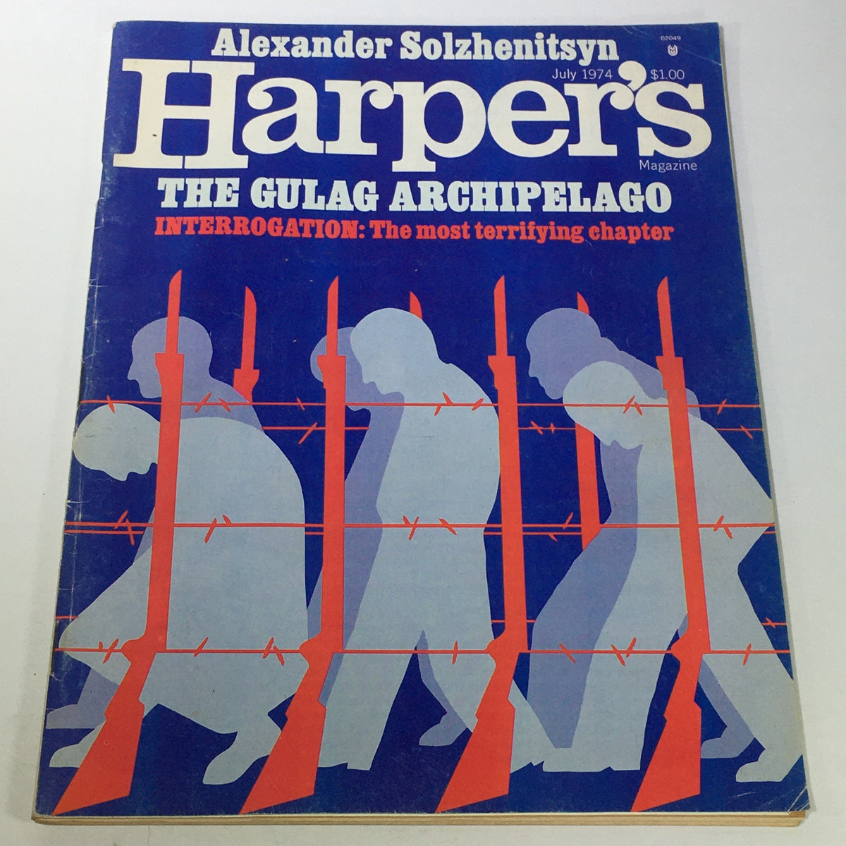 Cover of VTG Harper's Magazine July 1974 featuring The Gulag Archipelago. Illustrates silhouettes behind barbed wire with rifles, highlighting themes of interrogation and political turmoil.