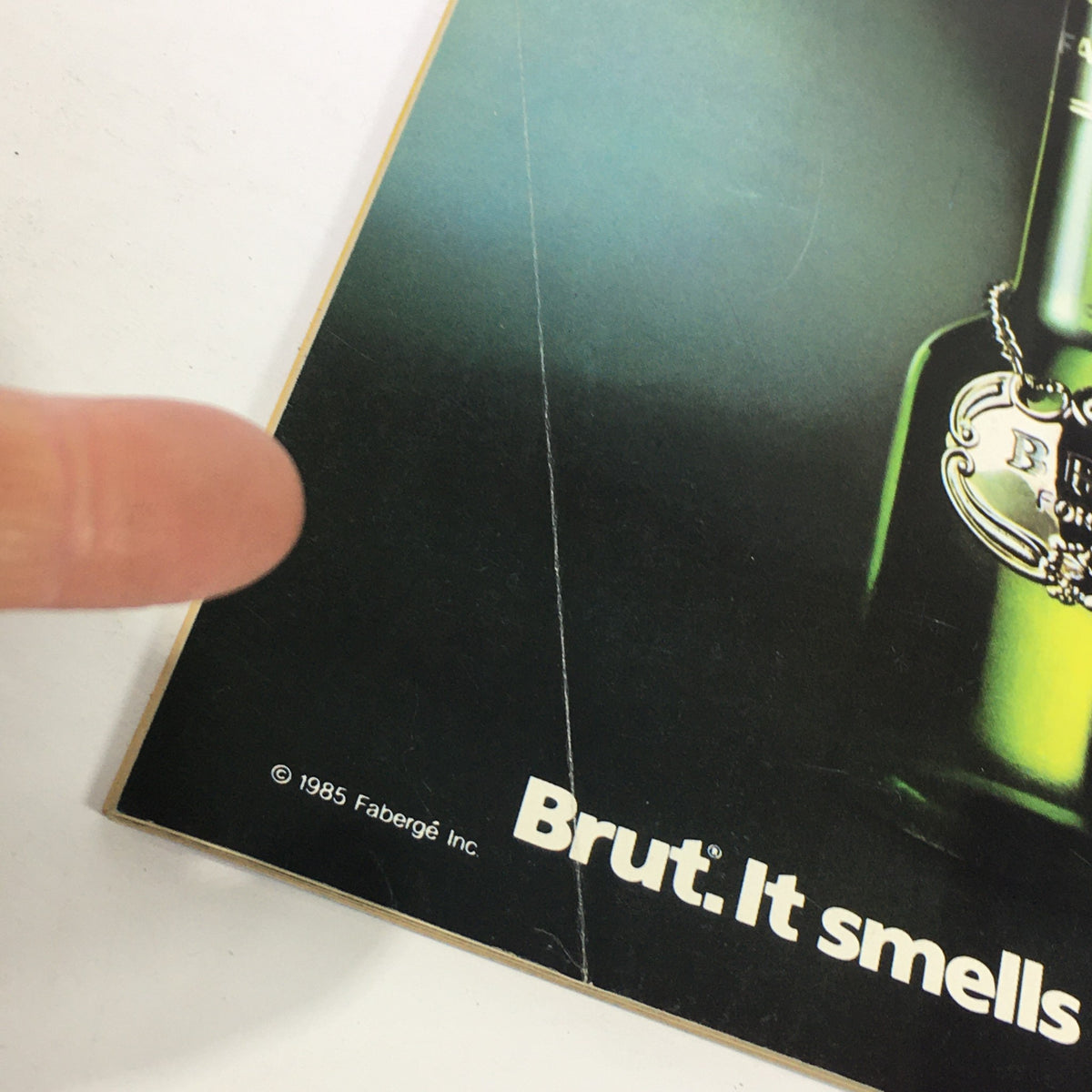 Back cover of the VTG WWF Magazine December January 1986-1987, showcasing a vintage advert for Brut fragrance with details visible.