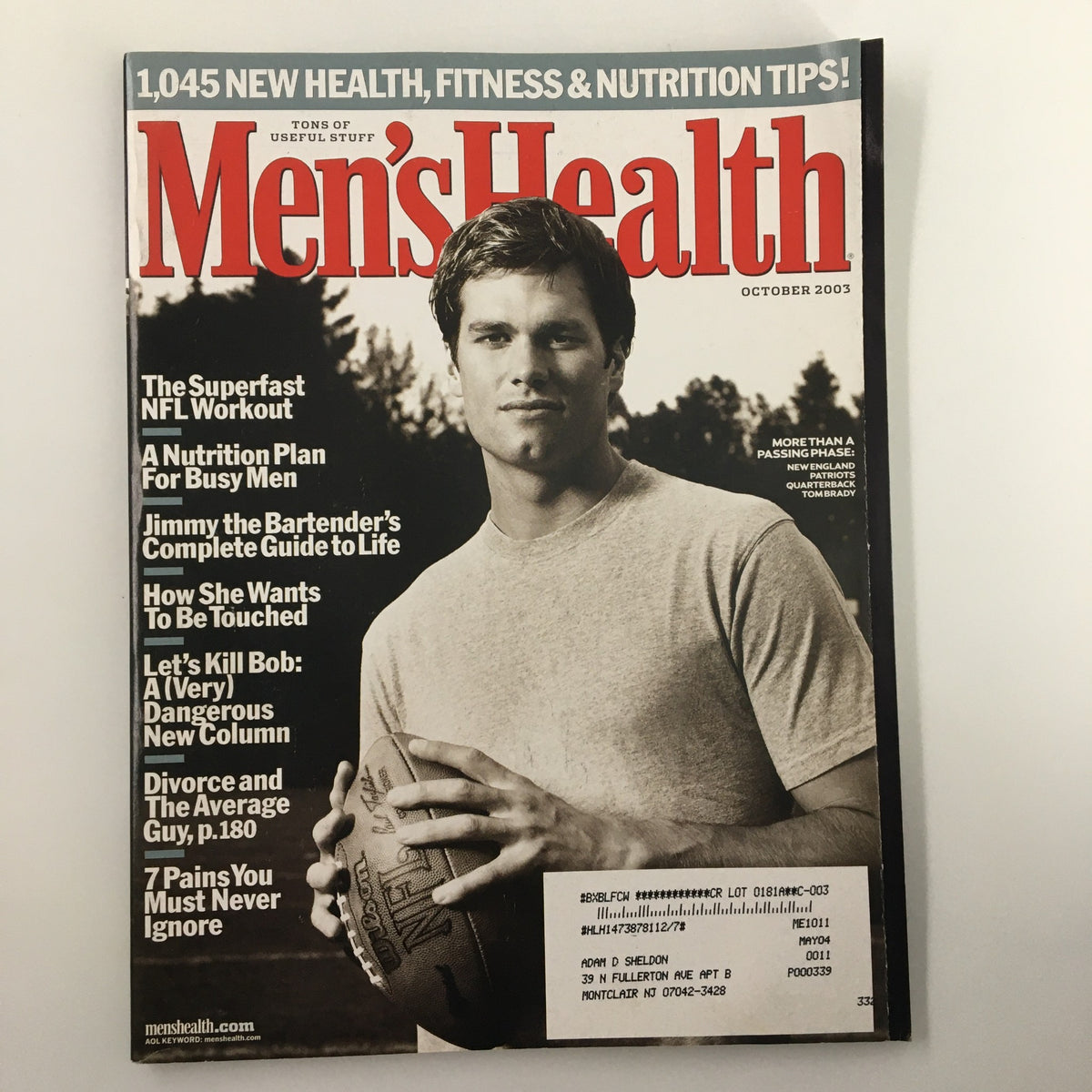 Men's Health Magazine October 2003 featuring New England Patriots quarterback Tom Brady on the cover, showcasing health tips and fitness insights.