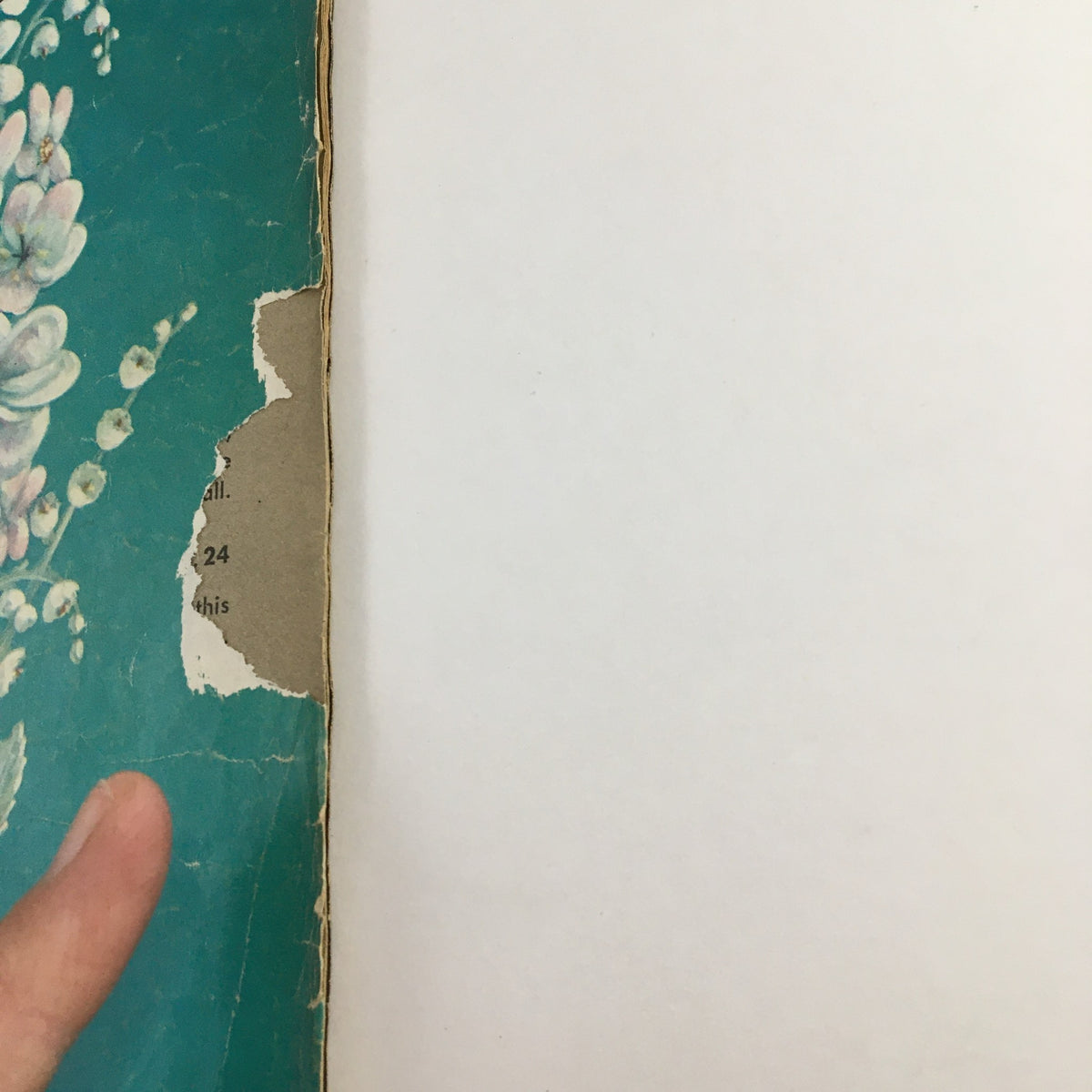 Side view of Mad Magazine July 1958, Issue No. 40, showing wear with a torn edge, highlighting its vintage condition for comic book enthusiasts.