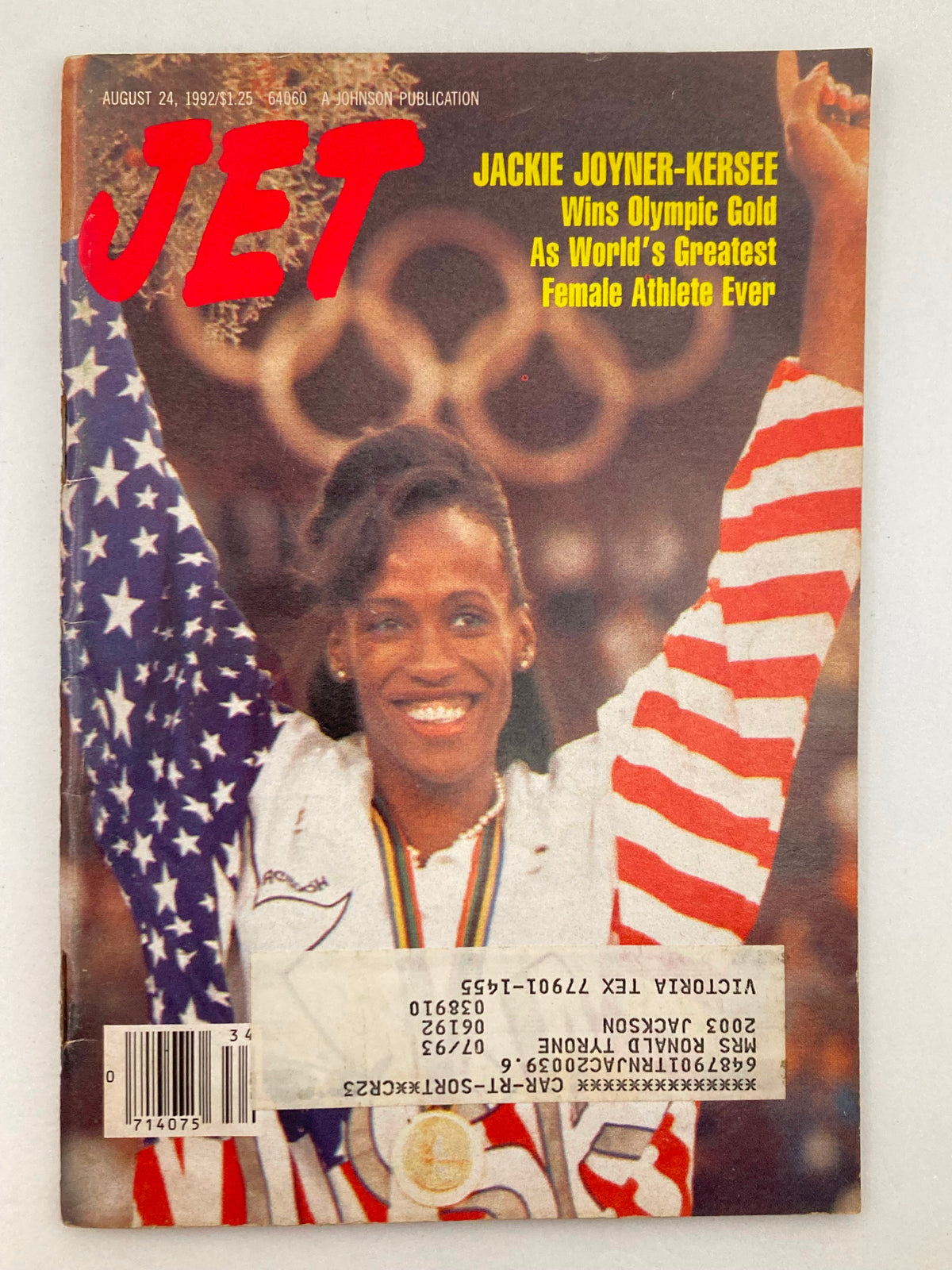 Cover of Jet Magazine from August 24, 1992, Vol 82 #18 featuring Jackie Joyner-Kersee celebrating her Olympic gold medal win, with American flag backdrop.