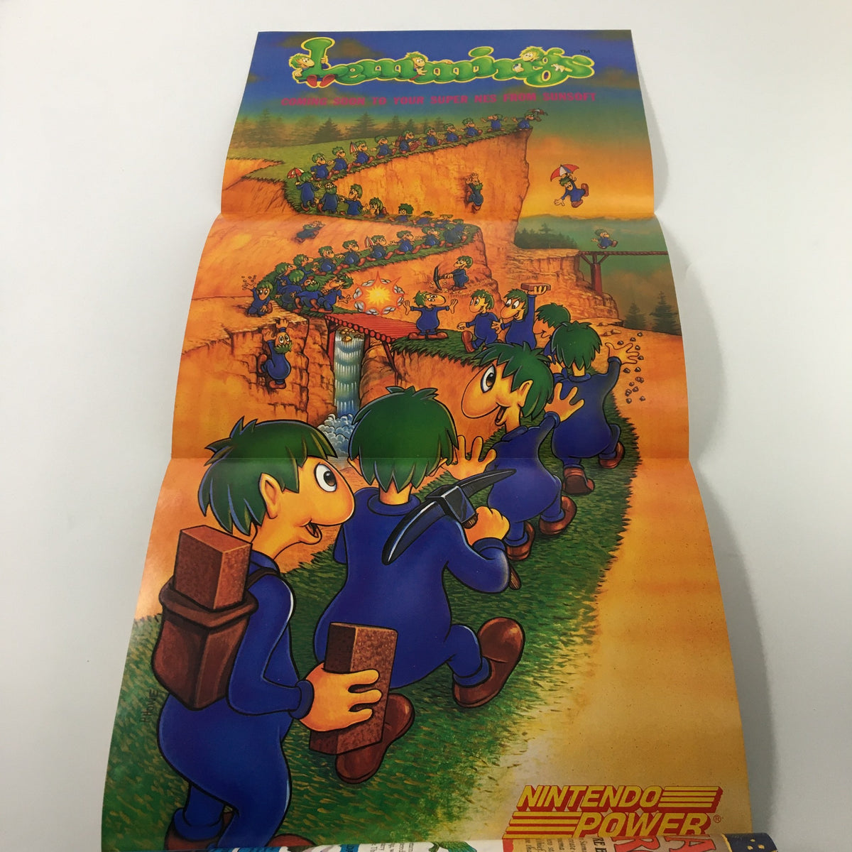 Collectible poster from Nintendo Power Magazine February 1992 #33 featuring cartoon characters from the game Lemmings, showcasing vibrant illustration.