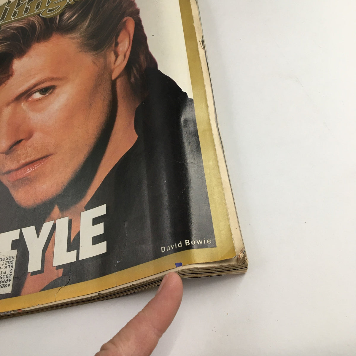 Close-up view of the cover of Rolling Stone Magazine, April 23, 1987, Issue 498, showcasing David Bowie's name prominently displayed, emphasizing his status as a fashion icon.