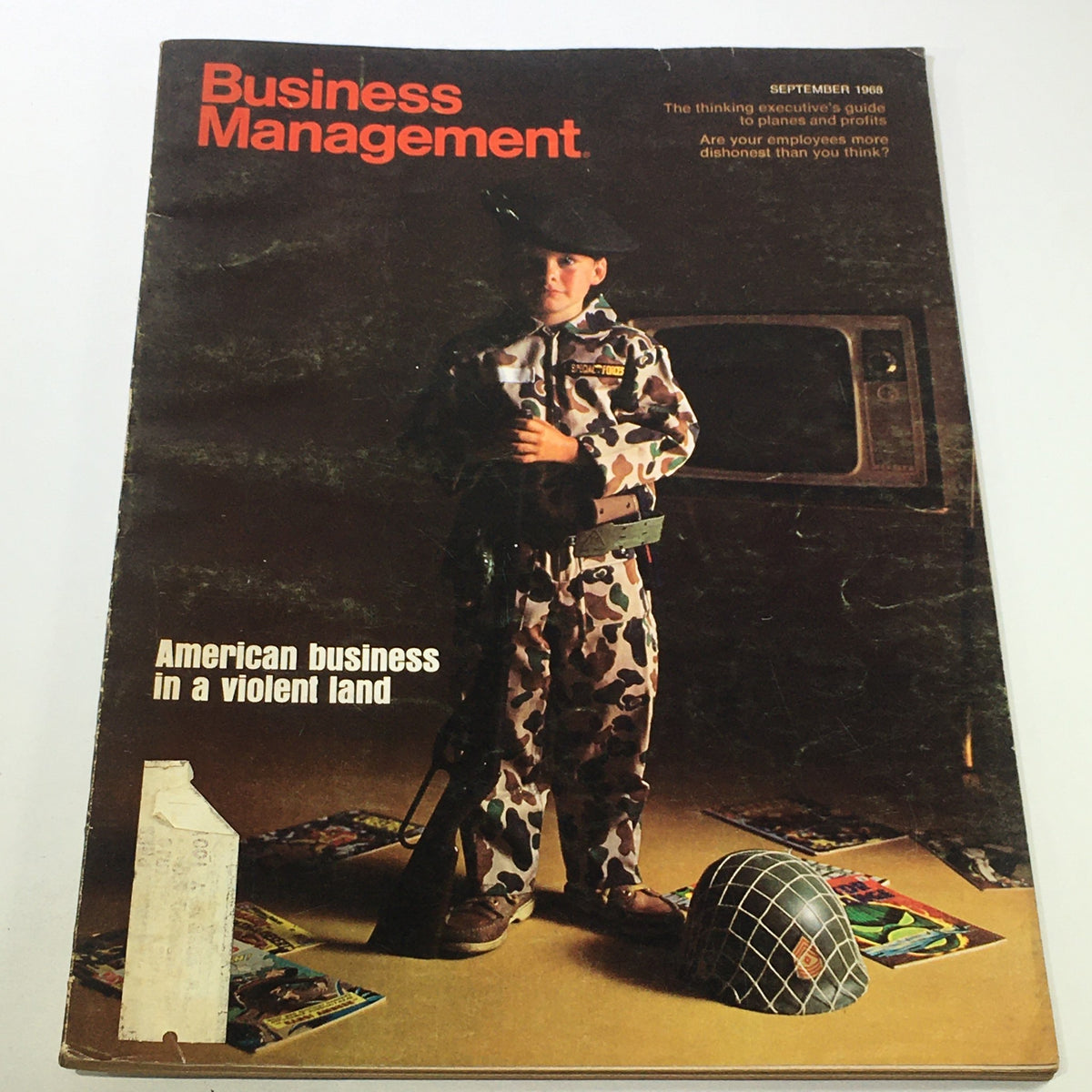 Cover of VTG Business Management Magazine from September 1968 featuring a child dressed in military-style clothing, standing amidst nostalgic toys, representing American business themes.