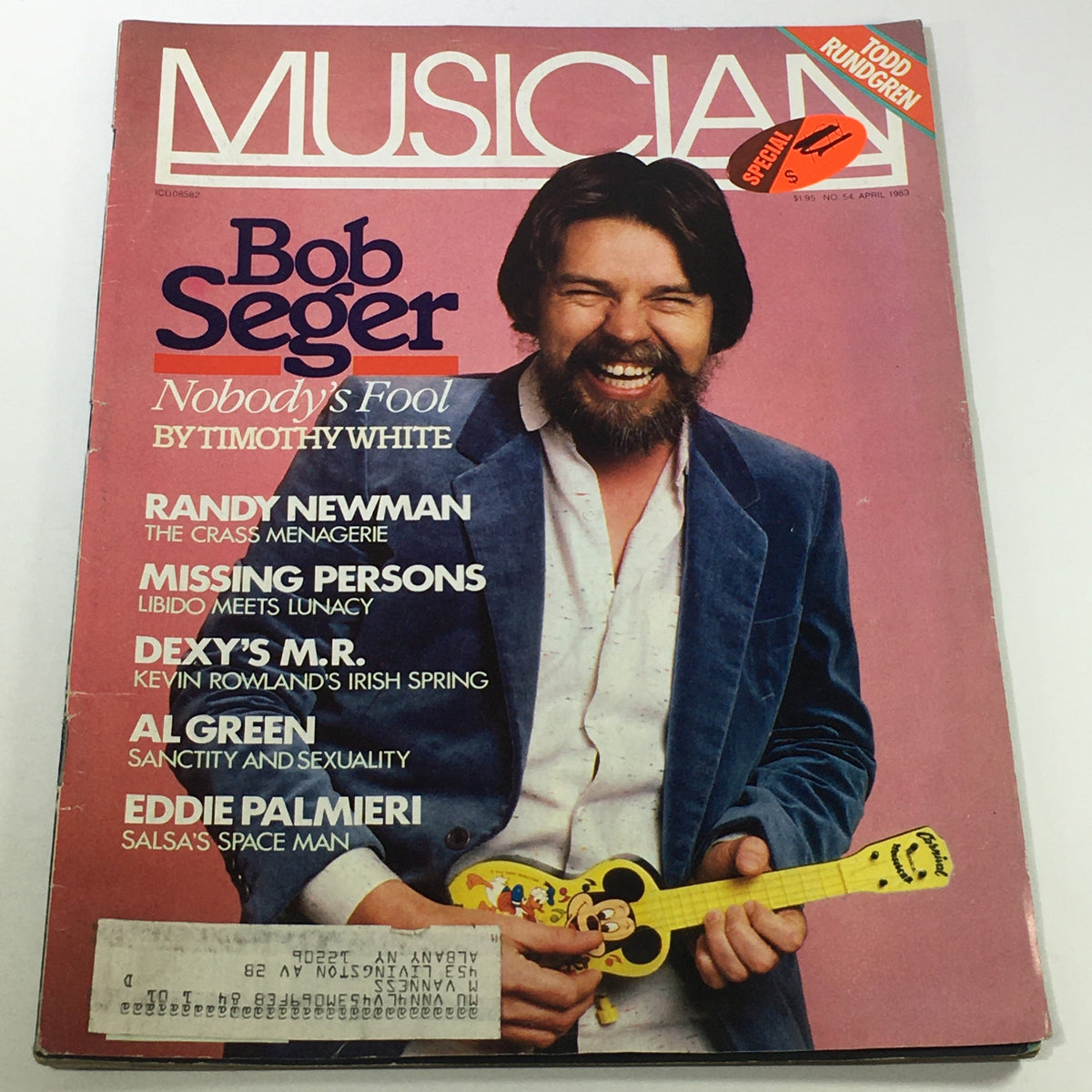 Cover of VTG Musician Magazine April 1983 #54 featuring Bob Seger, Randy Newman, Al Green, and other artists. The magazine showcases a vibrant design with Bob Seger smiling and holding a musical instrument, highlighting music culture from the early 1980s.