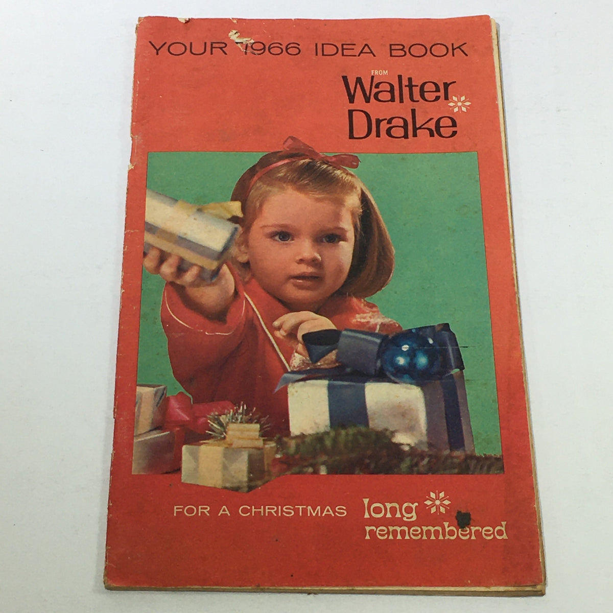 Cover of the VTG Rare Walter Drake Idea Book For Christmas Price Guide Catalog December 1966 featuring a young girl holding a gift with Christmas decorations.