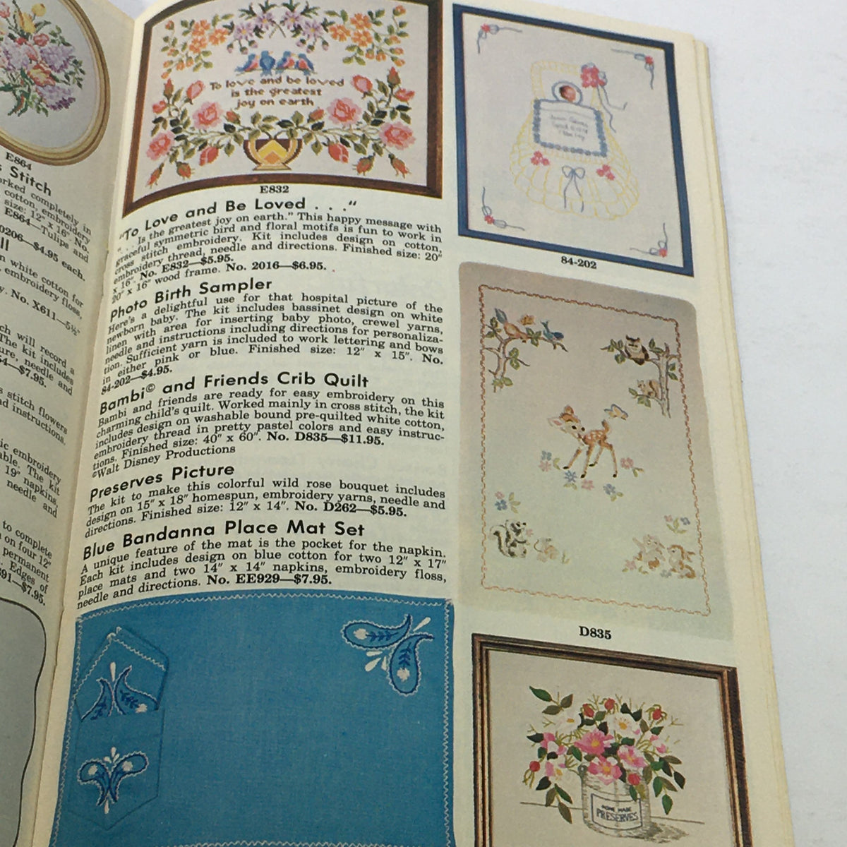 Page from VTG Rare The Stitchery 11th Year Price Guide Catalog showcasing colorful embroidery designs, including floral patterns and sampler styles from Spring-Summer 1975.