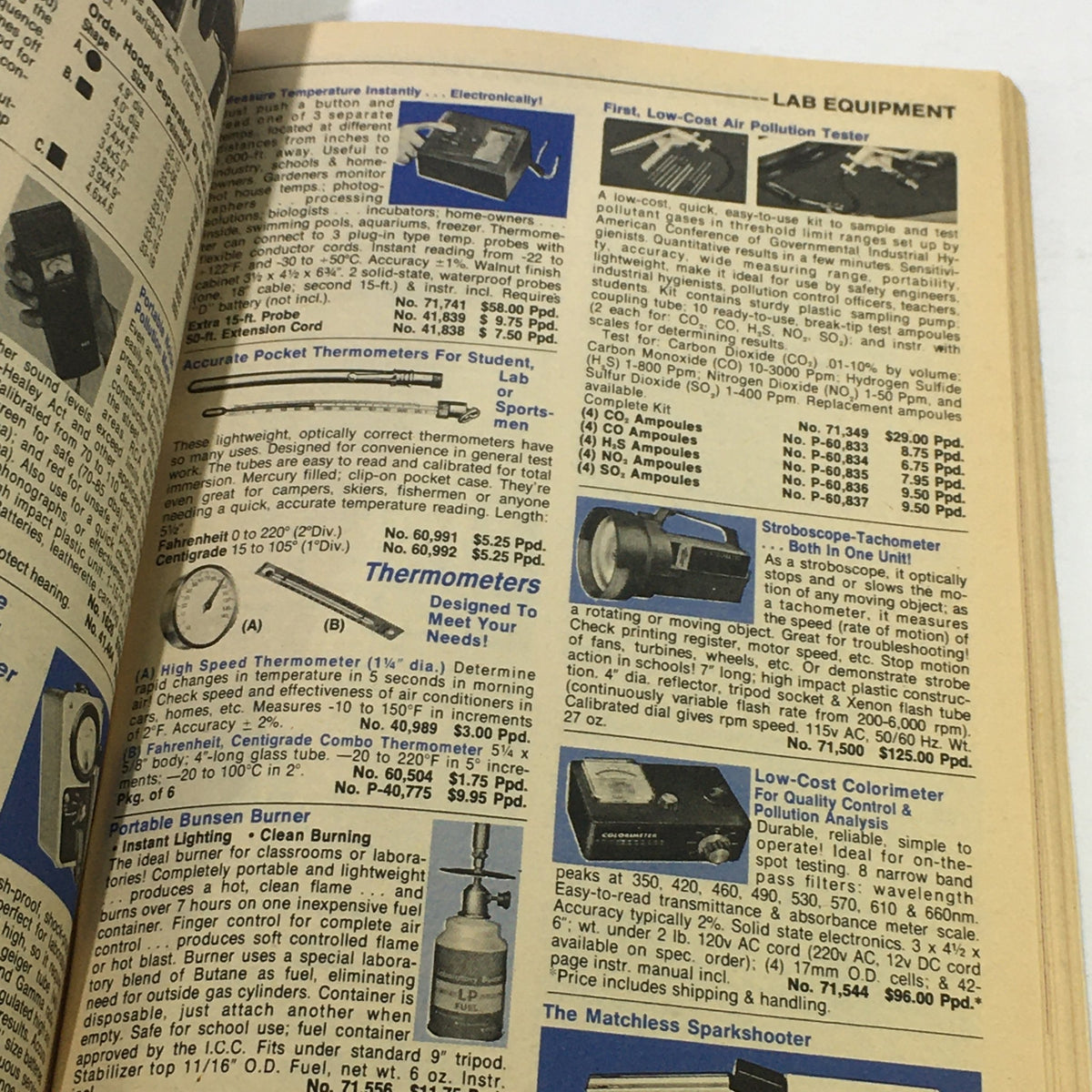 Inside page of VTG Rare Edmund America's Technology Catalog 761 from the Mid 1970s featuring lab equipment including thermometers, Bunsen burners, and pollution testers.