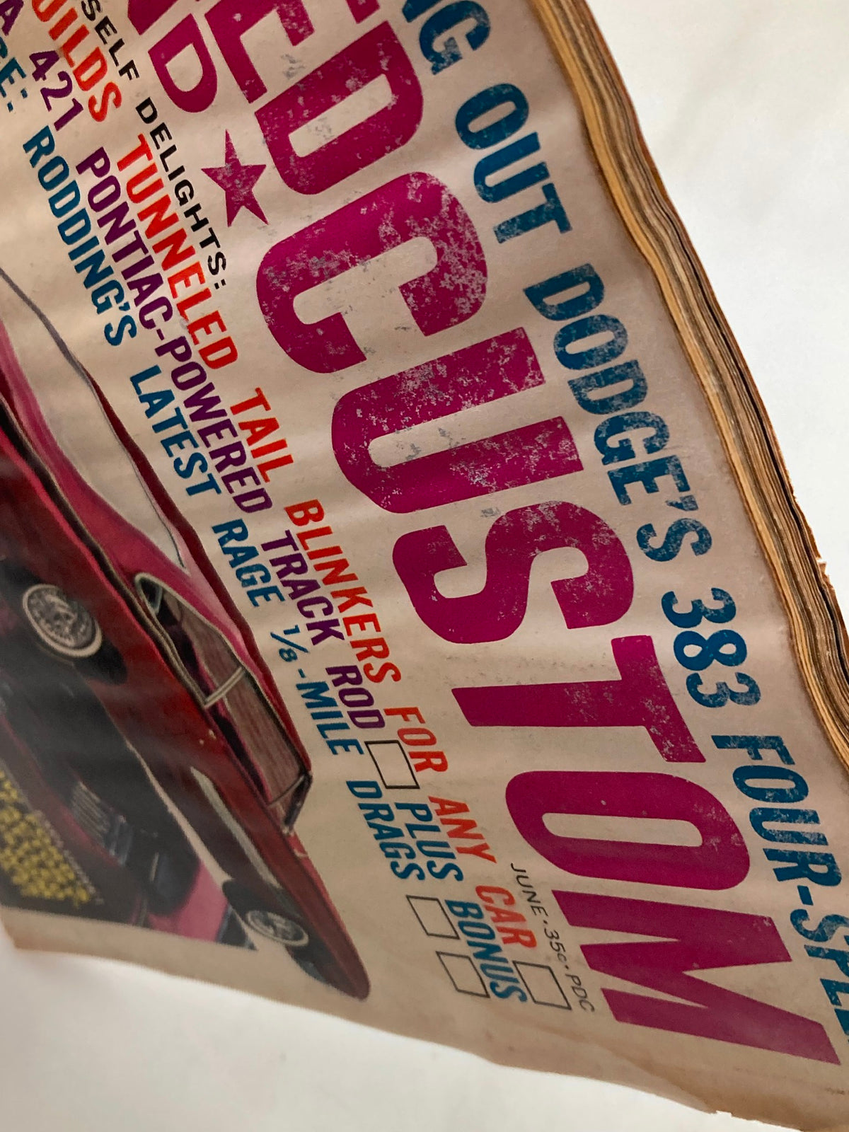 Close-up view of the cover of VTG Speed & Custom Magazine June 1963 Vol 11 #5 highlighting the magazine’s title and featured articles.