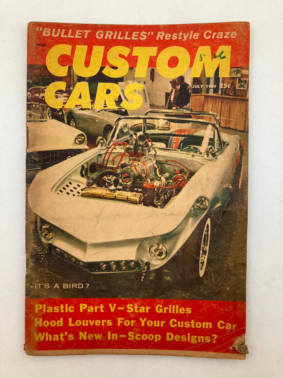 Cover of Custom Cars Magazine July 1959, Volume 2, Issue 11, featuring a stylish custom car with the title 'Custom Cars' prominently displayed alongside a vintage car advertisement.