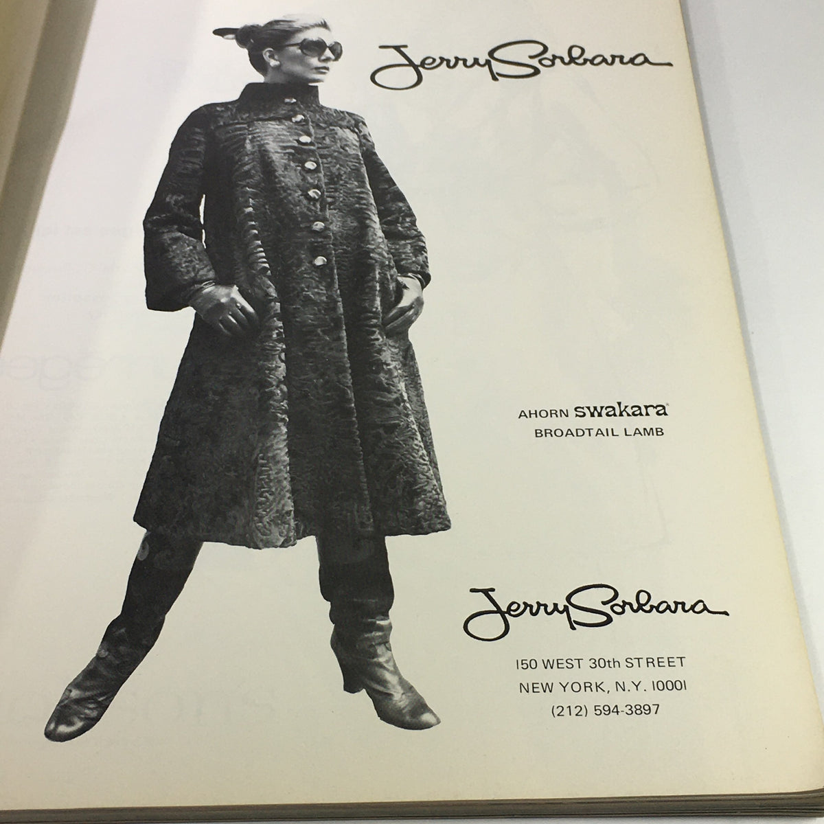 Page from VTG L'Officiel USA Magazine Fall Collection Issue 1976 displaying a black and white advertisement for Jerry Solbara featuring a model in a stylish coat.
