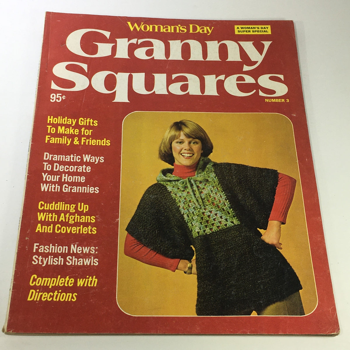 Cover of VTG Woman's Day Granny Squares No. 3 Magazine 1975 featuring stylish shawls and a woman modeling a crocheted poncho. The magazine highlights holiday gifts, home decoration ideas, and crochet patterns.