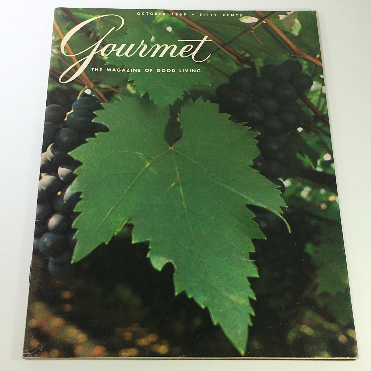 Cover of VTG Gourmet The Magazine of Good Living, October 1969 edition, featuring a vibrant grape leaf against a backdrop of grapes, symbolizing culinary excellence and good living.