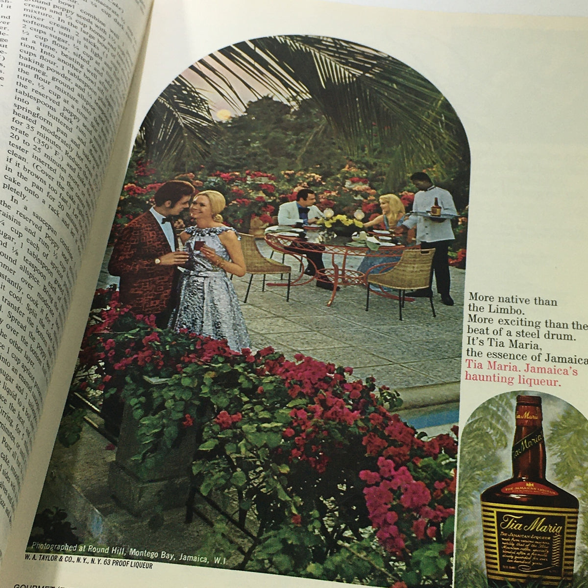 Image from VTG Gourmet The Magazine of Good Living February 1975 featuring a glamorous outdoor dining scene with a couple enjoying drinks surrounded by colorful flowers. The image captures the essence of 1970s gourmet living.