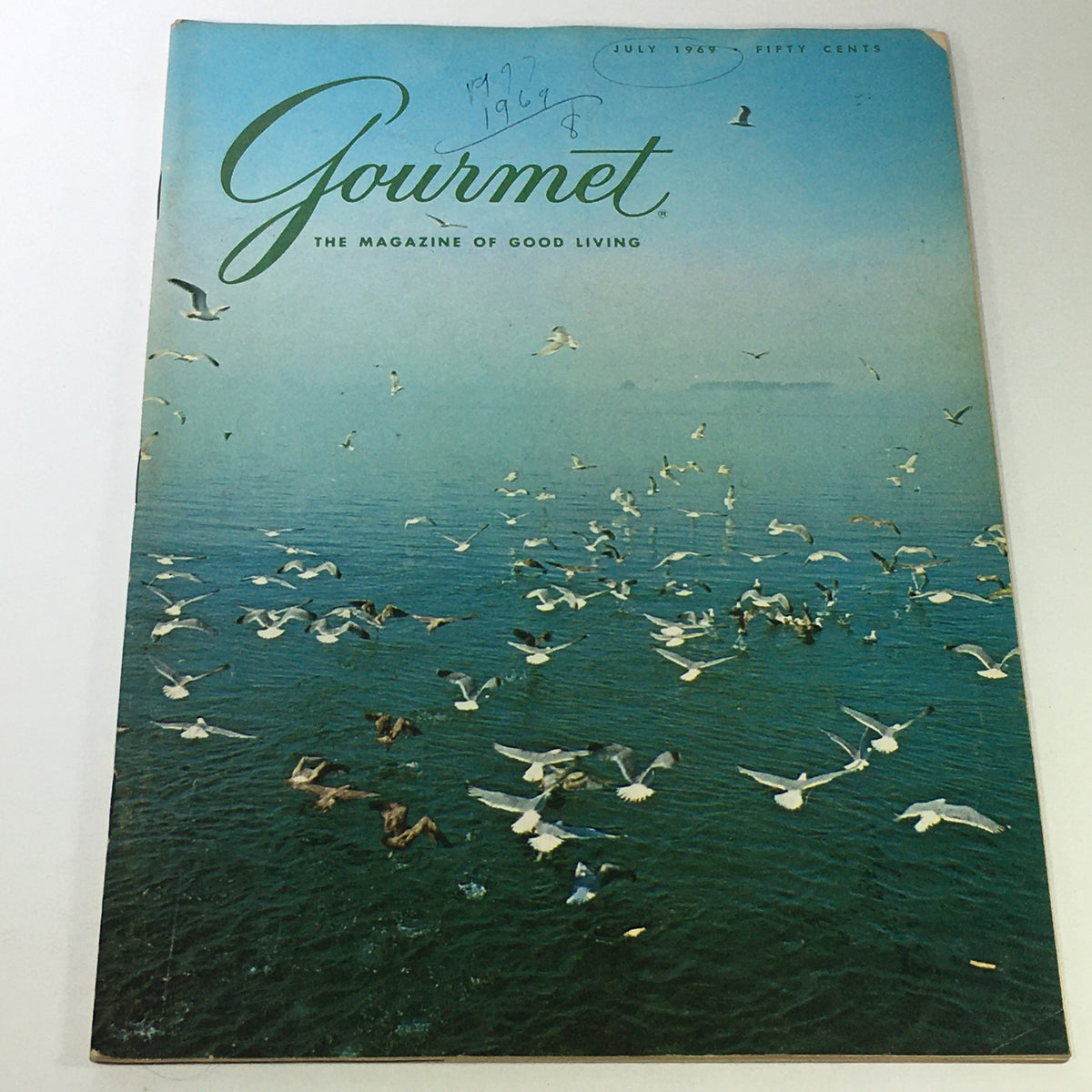 Cover of VTG Gourmet: The Magazine of Good Living July 1969 featuring a serene seaside scene with seagulls flying over the water.