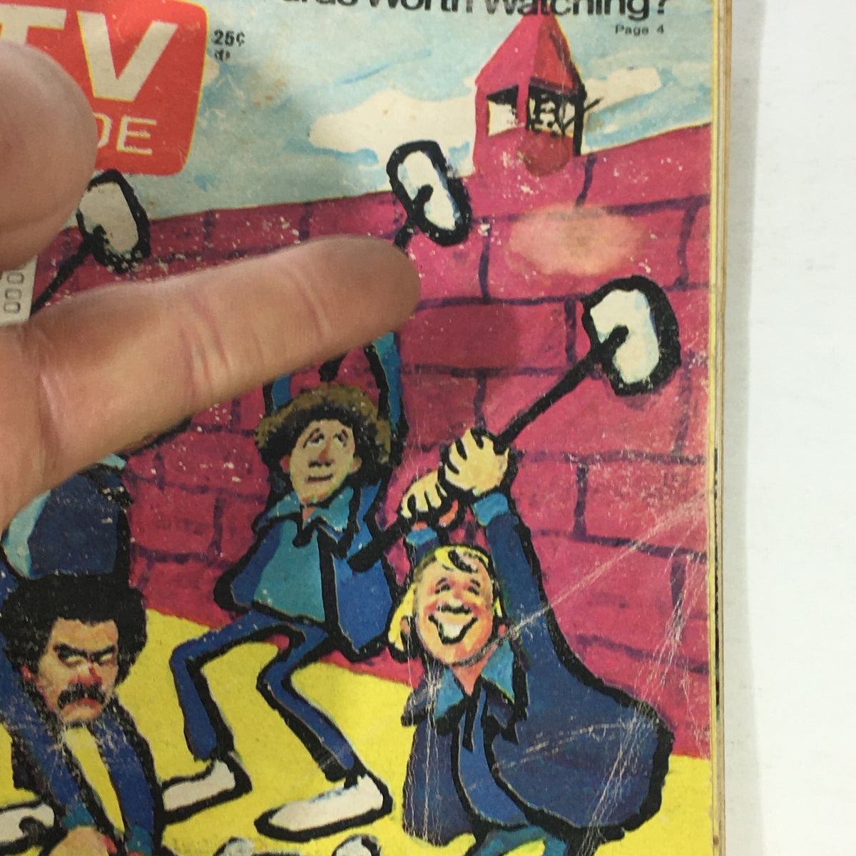 Close-up view of the May 15, 1976 VTG TV Guide cover featuring the episode 'On The Rocks' Cellmates, highlighting cartoon characters and a brick background.