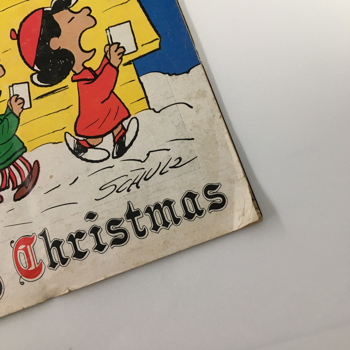 Detail of the vintage Newsweek magazine titled Merry Christmas from December 27, 1971, showcasing Peanuts characters singing with a snowy background.