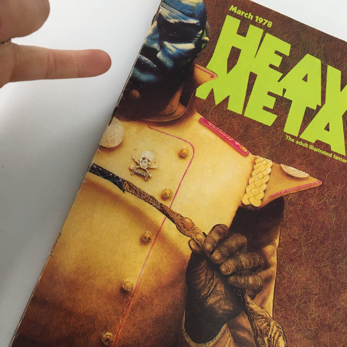 Close-up of the cover of VTG Heavy Metal Magazine March 1978 Vol I #12, highlighting the striking design and the character Colonel King.