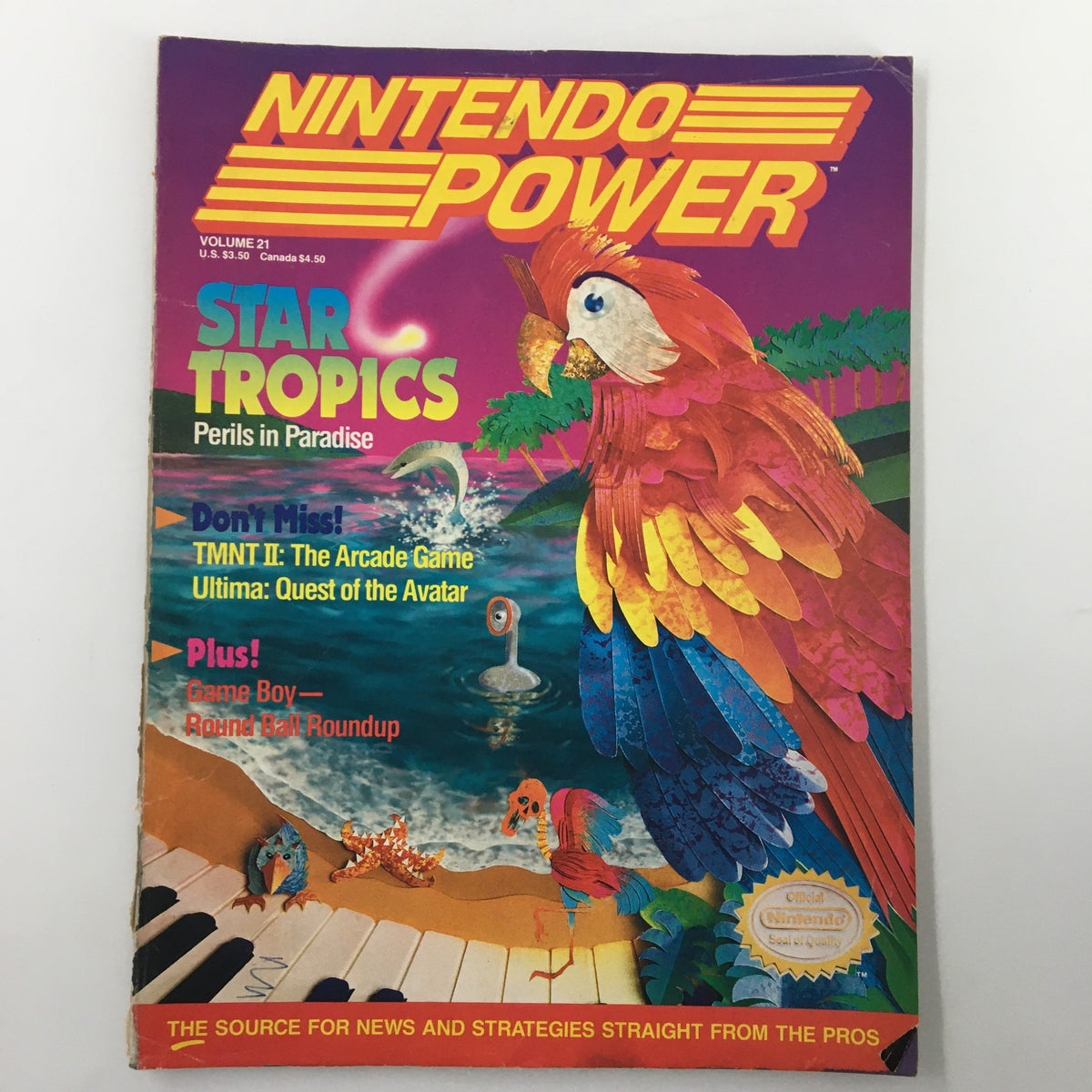 Cover of Nintendo Power Magazine February 1991 #21 featuring Star Tropics Perils in Paradise, showcasing vibrant artwork including a colorful parrot and gaming references.