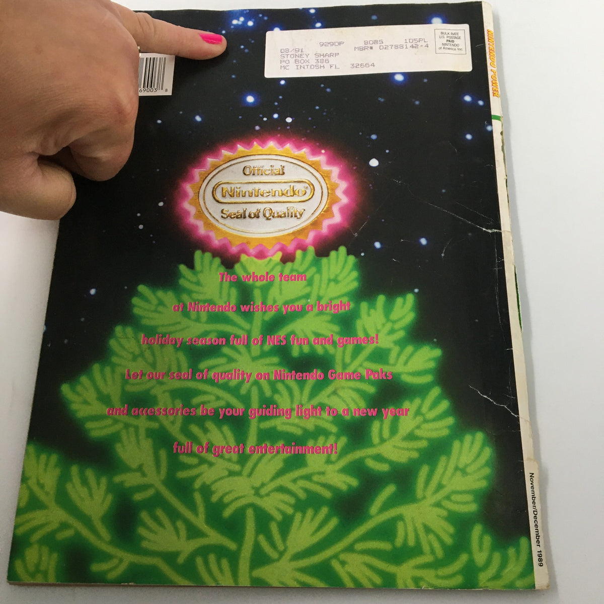 Back cover of Nintendo Power Magazine November 1989, featuring the Official Nintendo Seal of Quality and a holiday greeting.
