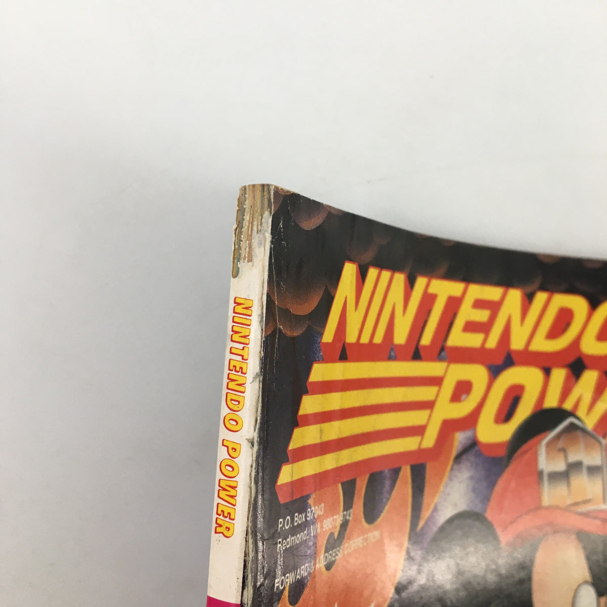 Side view of Nintendo Power Magazine January 1993 #44, showcasing worn edges and the iconic title prominently displayed.