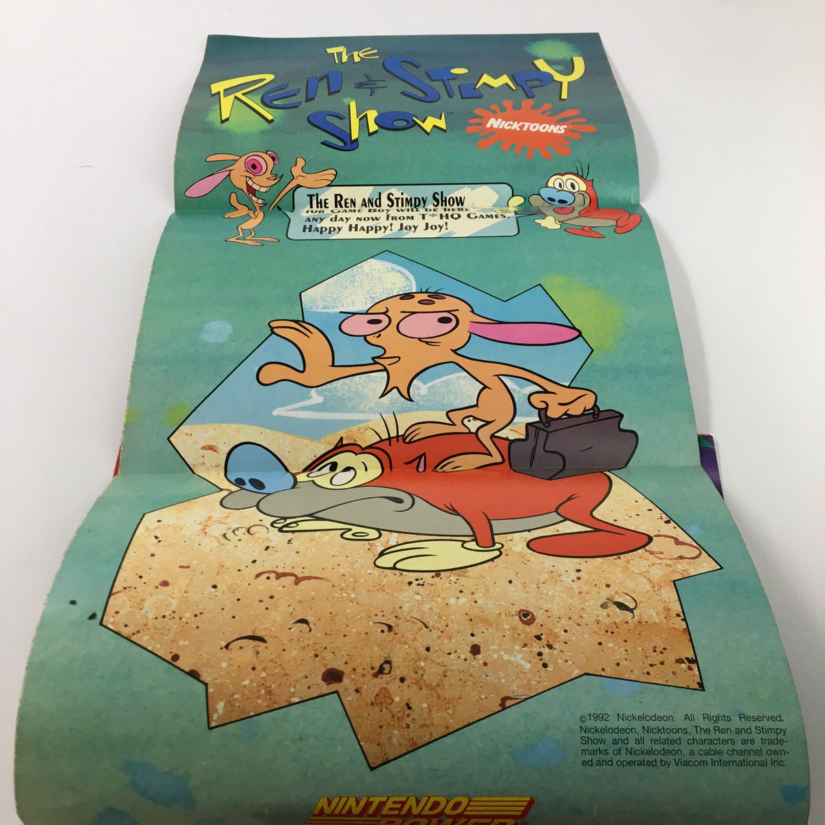Vintage poster from Nintendo Power Magazine featuring characters from The Ren & Stimpy Show, highlighting retro gaming culture.