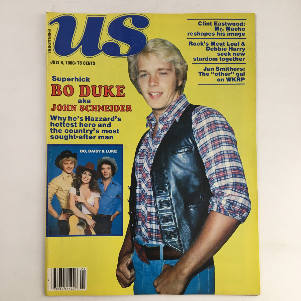 Cover of US Magazine dated July 8, 1980 featuring Bo Duke, also known as John Schneider, in a plaid shirt and leather vest. The magazine highlights Clint Eastwood, Mr. Macho, along with articles on Meat Loaf, Debbie Harry, and the cast of WKRP. The cover showcases Bo, Daisy, and Luke from The Dukes of Hazzard as featured characters.