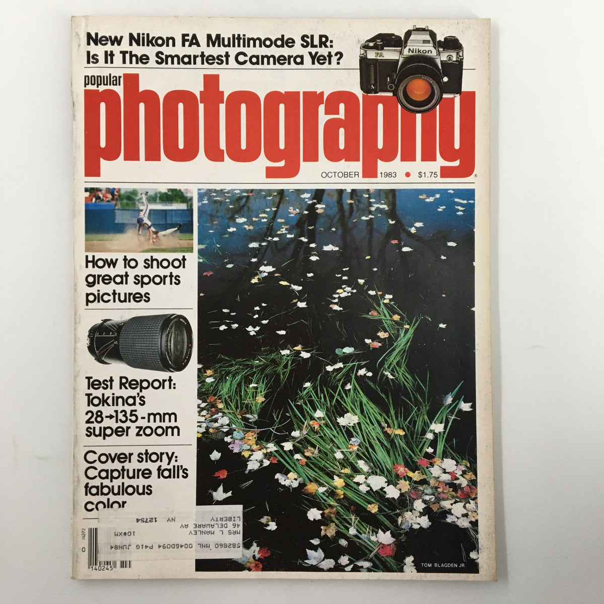 Cover of Popular Photography Magazine from October 1983, featuring articles on how to shoot great sports pictures, test reports, and a vibrant image of flowers on water.