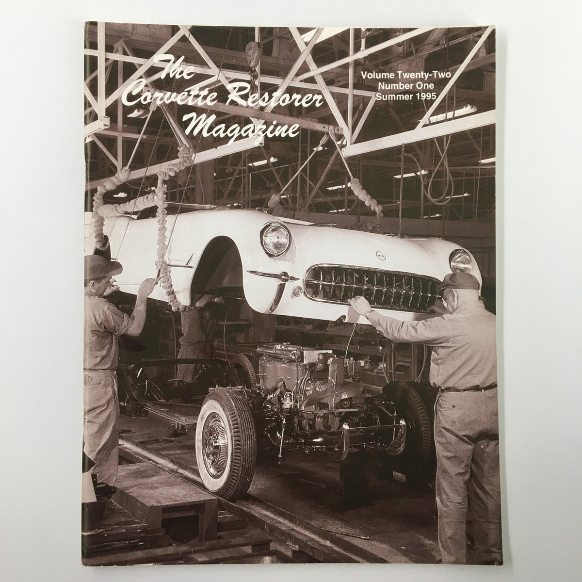 Cover of The Corvette Restorer Magazine Summer 1995 featuring an iconic Corvette being assembled, showcasing the title and vintage automotive restoration theme.