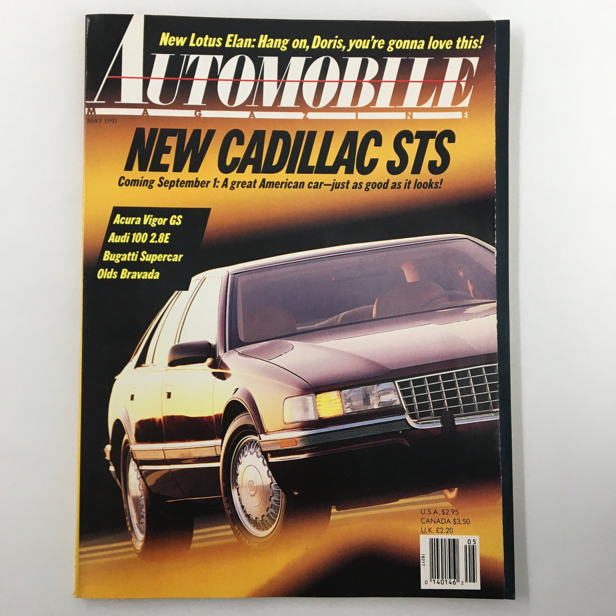 Automobile Magazine May 1991 featuring the new Cadillac STS on the cover, showcasing its luxury design and listing other car models like Acura Vigor GS and Audi 100 2.8E.