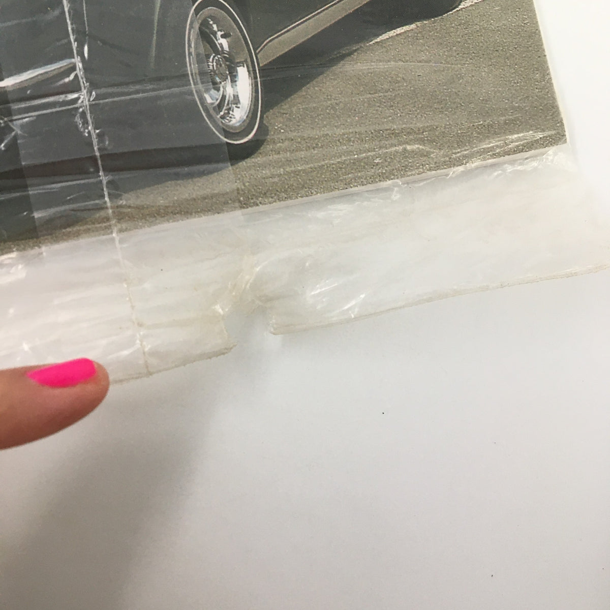 Close-up image of the magazine The Corvette Restorer Magazine Fall 2003 Vol. 30 #2, highlighting the condition and wear of the plastic packaging.